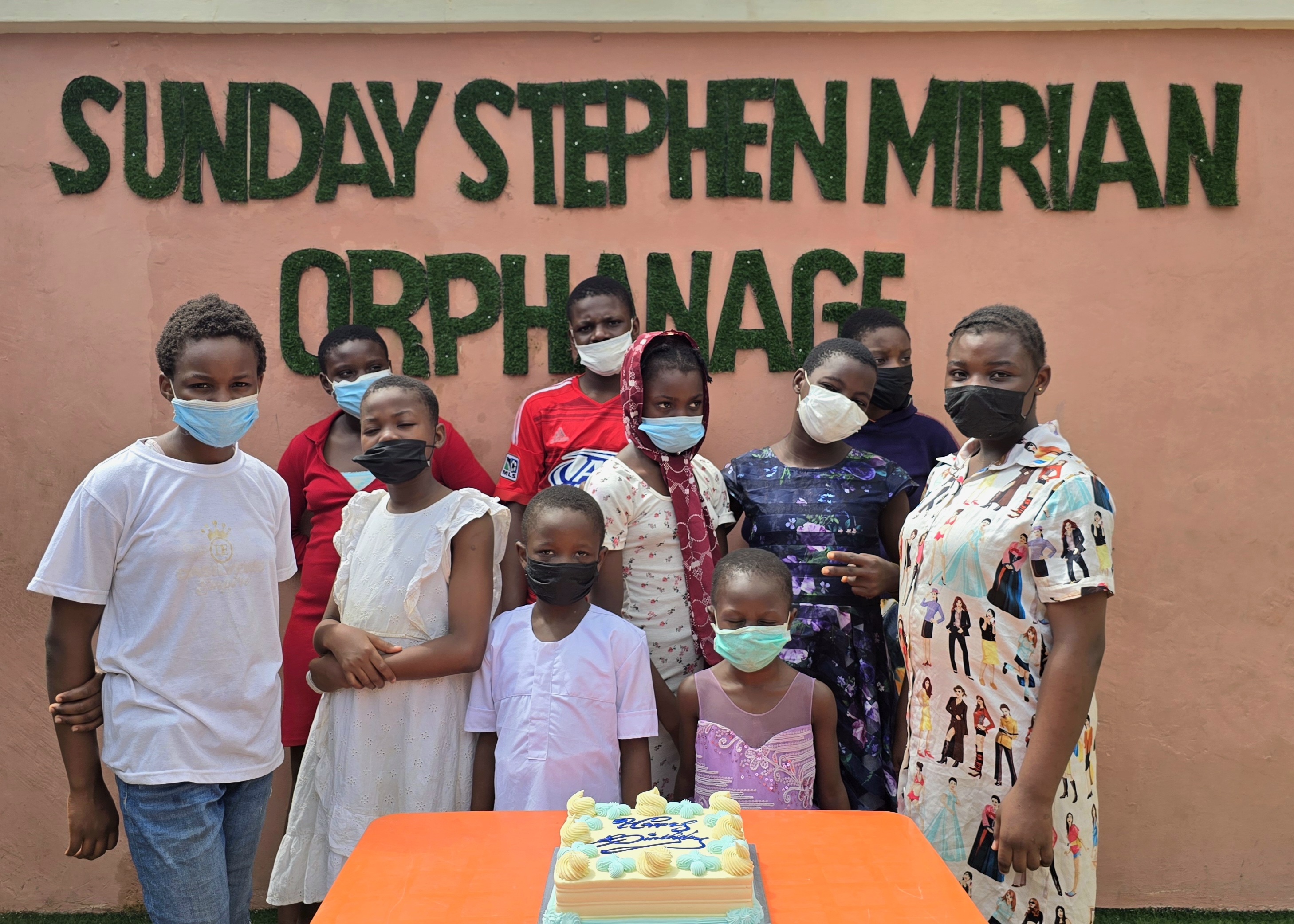 Children of Sunday Stephen Mirian Orphanage with birthday cake